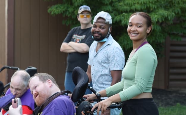 This links to our Employment Application. Picture of Staff members with individuals they support at Pleasant View.