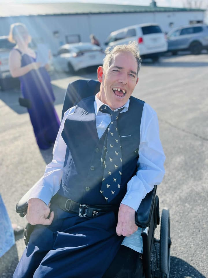 man who uses a wheel chair is dressed up and ready to dance